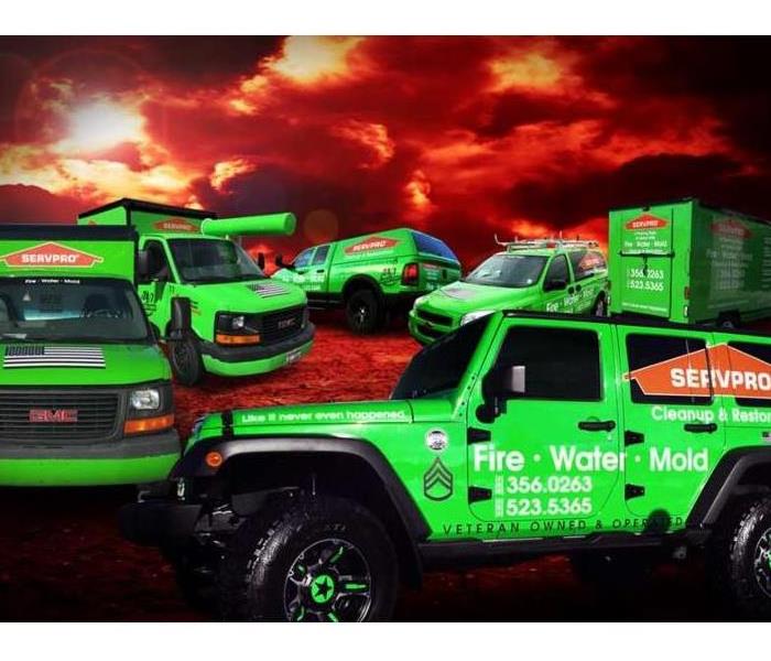 servpro trucks in foreground of a red ominous sky